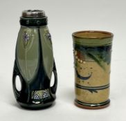 An Art Nouveau twin-handled vase complete with four panels of mauve floral detail on a green ground,
