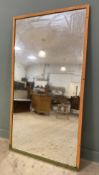 A substantial mid-century mirror, rectangular plate enclosed within reeded pine frame, later