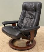 A Norwegian reclining armchair by Ekornes, model Stressless, with black leather back and seat raised