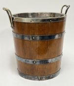 A Victorian oak ice bucket of tapered form with four plated bands and fitted interior (h. 27cm)