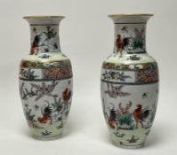 A pair of late 20thc Macau porcelain Chinese import urns of bulbous form, decorated with cockerals