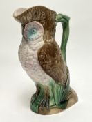 A late 19thc Majolica pitcher in the form of an owl, with polychrome enamels (h. 27cm)