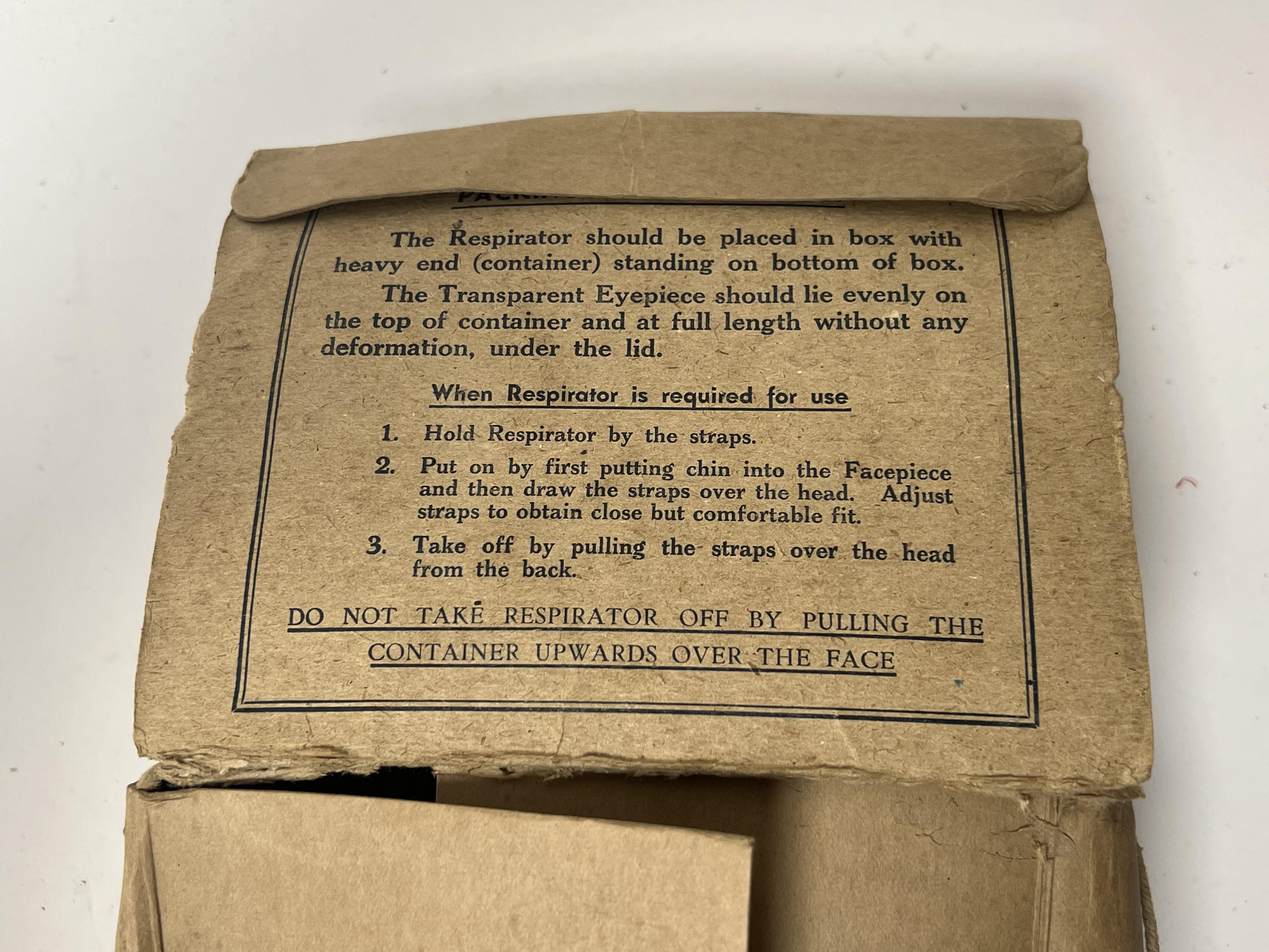 A WWII gas mask, bearing 'Lot 2157' to front, medium printed to side strap, issued by Glasgow A.R.P. - Image 5 of 5