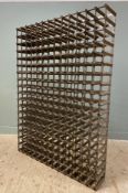A substantial steel and pine wine rack, capacity for 252 bottles: H. 180cm L. 130cm D. 23cm