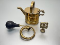 A collection of various vintage brass wares comprising, a brass four pint watering can (h-27cm), a