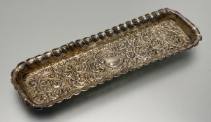 An Edwardian Birmingham silver jewellery tray with embossed rococo C and S scroll design: h. x 1.5cm