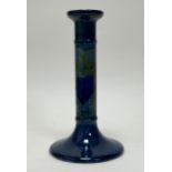 A William Moorcroft candlestick in the 'Moonlit' pattern, decorated with a hand-painted and
