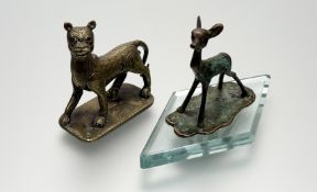 A 1920s/30s stylised verdegris bronze fawn figure mounted on damond shaped glass base: h. x 8cm l. x
