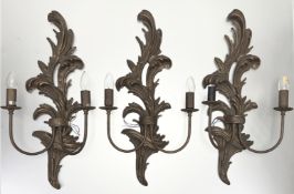 A trio of David Hunt Lighting carved foliate rococo style wooden light wall sconces, each with
