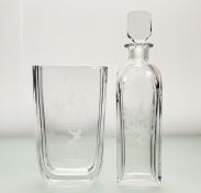 An Orrefors Scandinavian crystal decanter (h-30.5cm) and tall vase (h-20cm) in a Romeo and Juliet