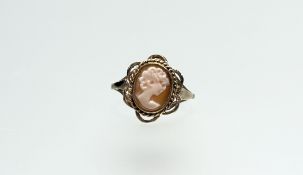 A 9ct gold ring set oval shell carved portrait cameo within openwork and rope pattern border O 2.