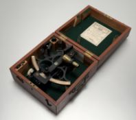 A 20thc black enamelled brass sextant in a fitted wooden case with a Henry Hughes & Sons Ltd