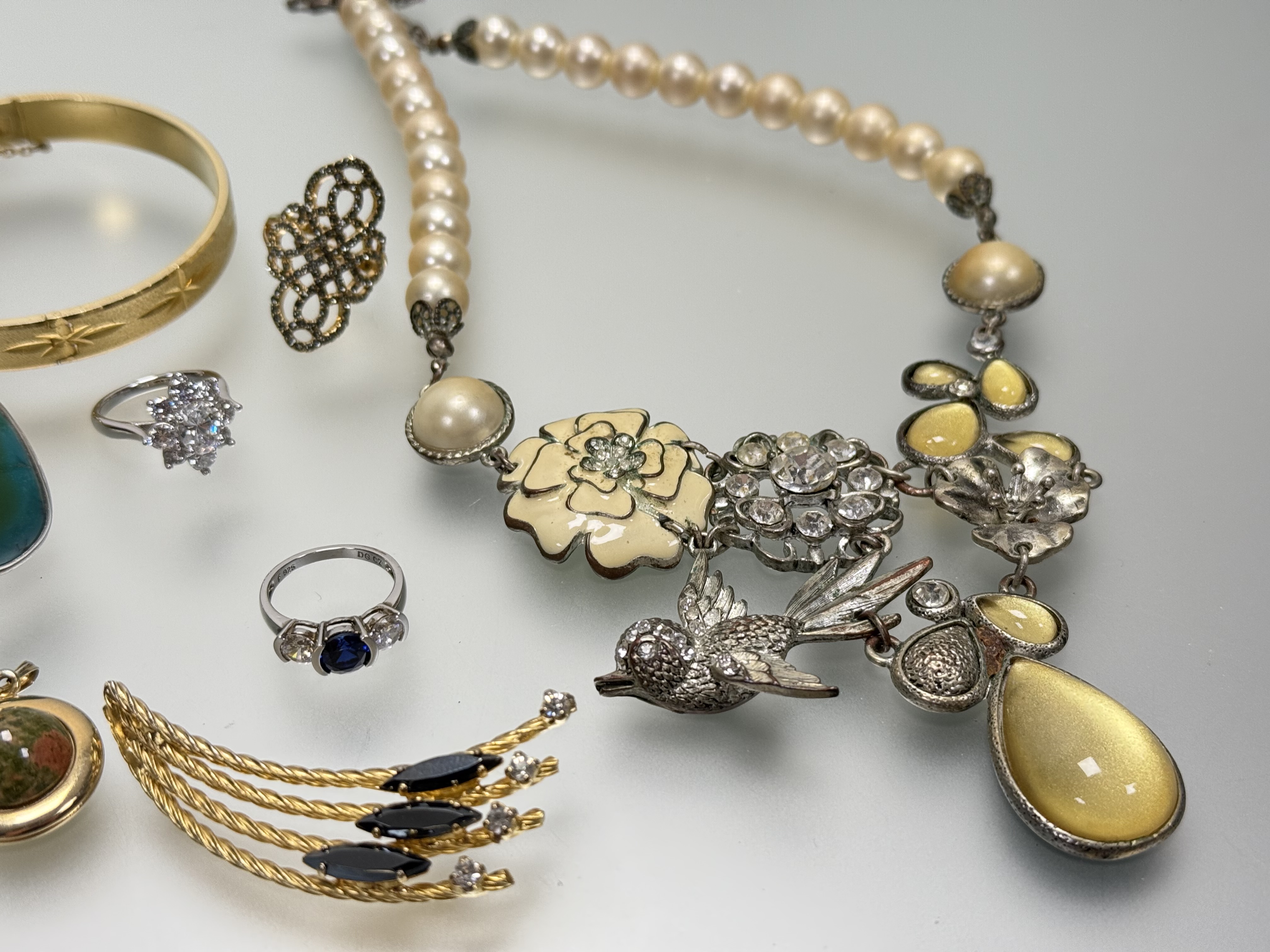 A collection of costume jewllery to include a silver CZ set cluster ring L/M 4.7g, a silver three - Image 2 of 3