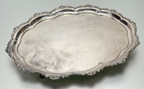 A epns scalloped drinks bottle stand with floral, beaded and leaf border with engraved centre on