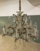 A 20th century cut glass Louis XV-style chandelier, fifteen arms on two tiers with hanging