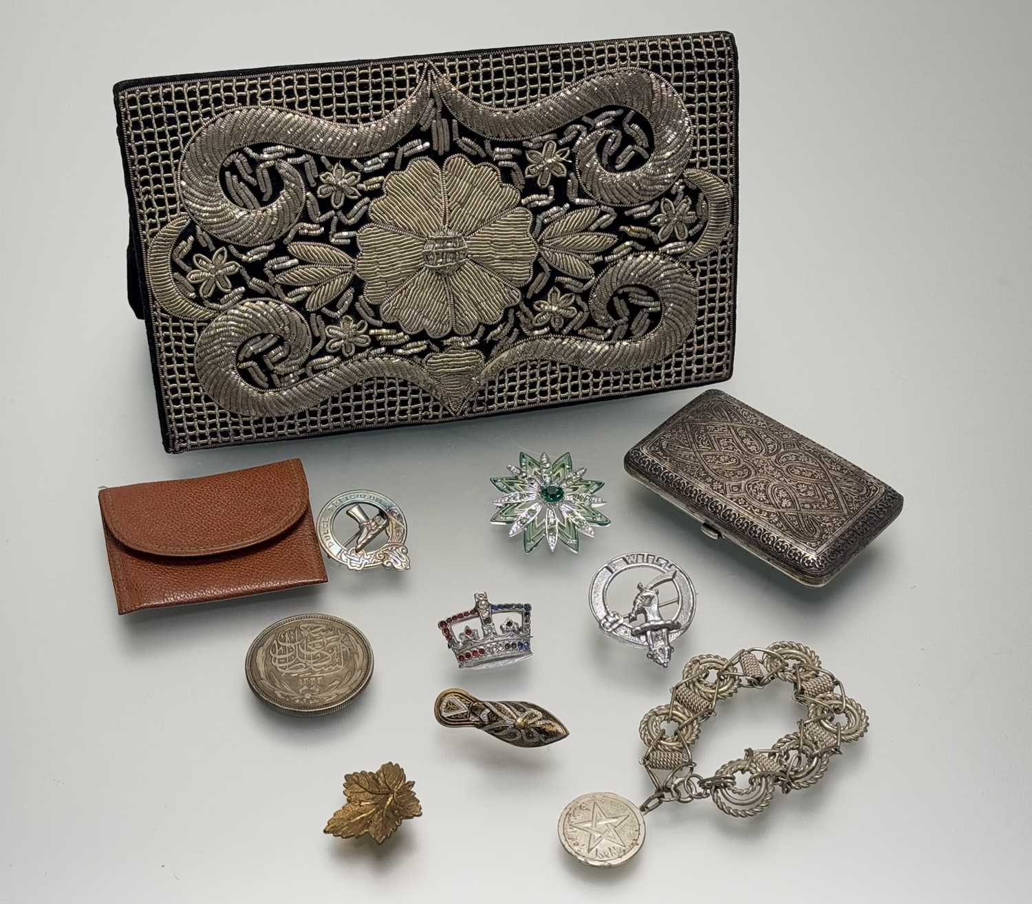 A collection of costume jewellery to include a Moroccan white metal rope link bracelet: d. x 6cm