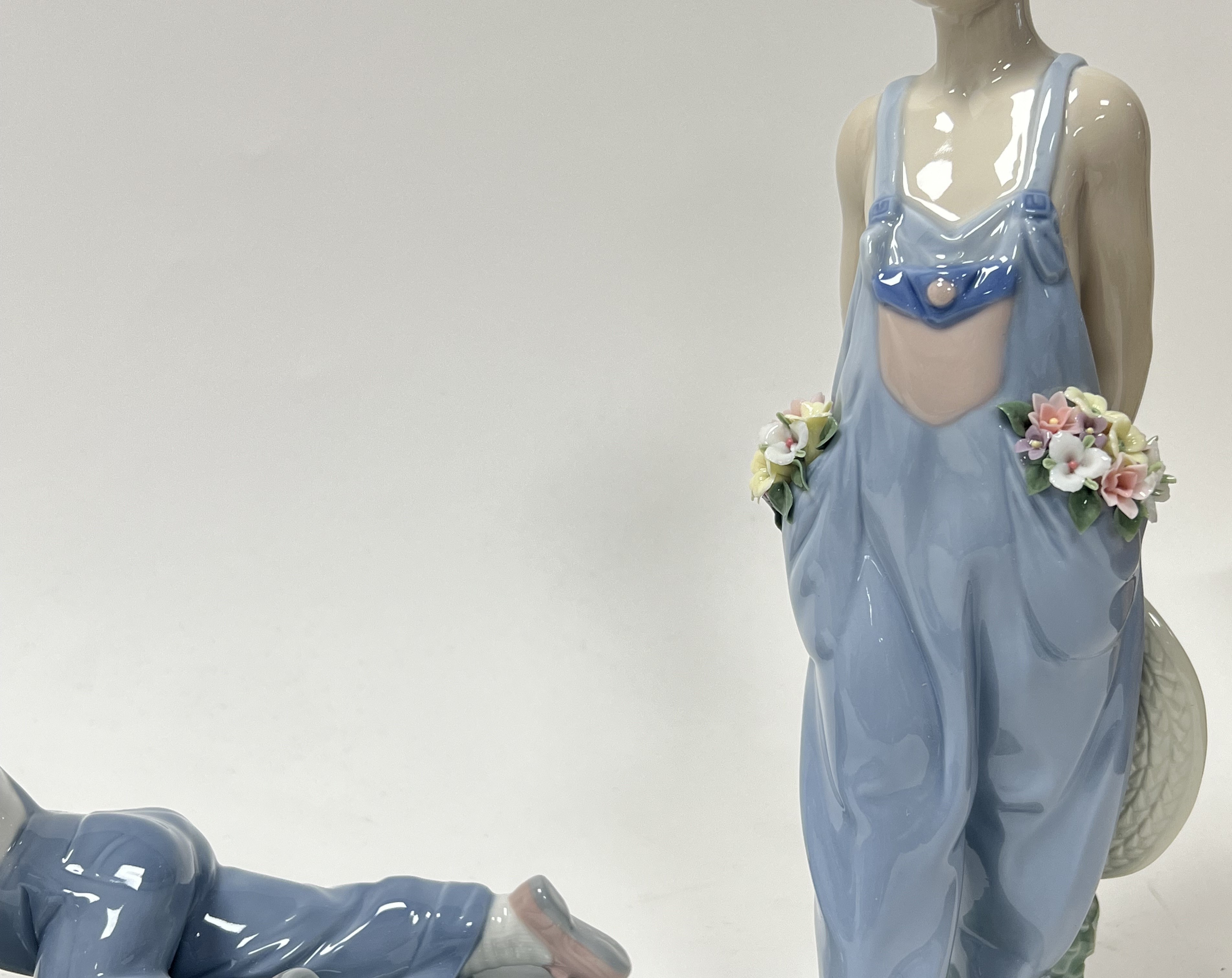 A Lladro porcelain figurine 'All Aboard', modelled as a young boy playing with a train set, No. - Image 3 of 6