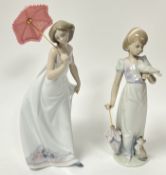 A Lladro porcelain figurine 'Summer Stroll', modelled as a young girl holding a bird and an umbrella