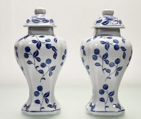 A pair of late 20thc blue and white flower bud pattern ginger jars with covers. (h-39cm) (2)