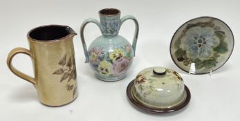 A collection of Chelsea Pottery, comprising a pitcher decorated with a sprouting flower on a tan