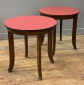 A pair of mid-century cafe tables, circular tops with red formica inserts, raised on reeded