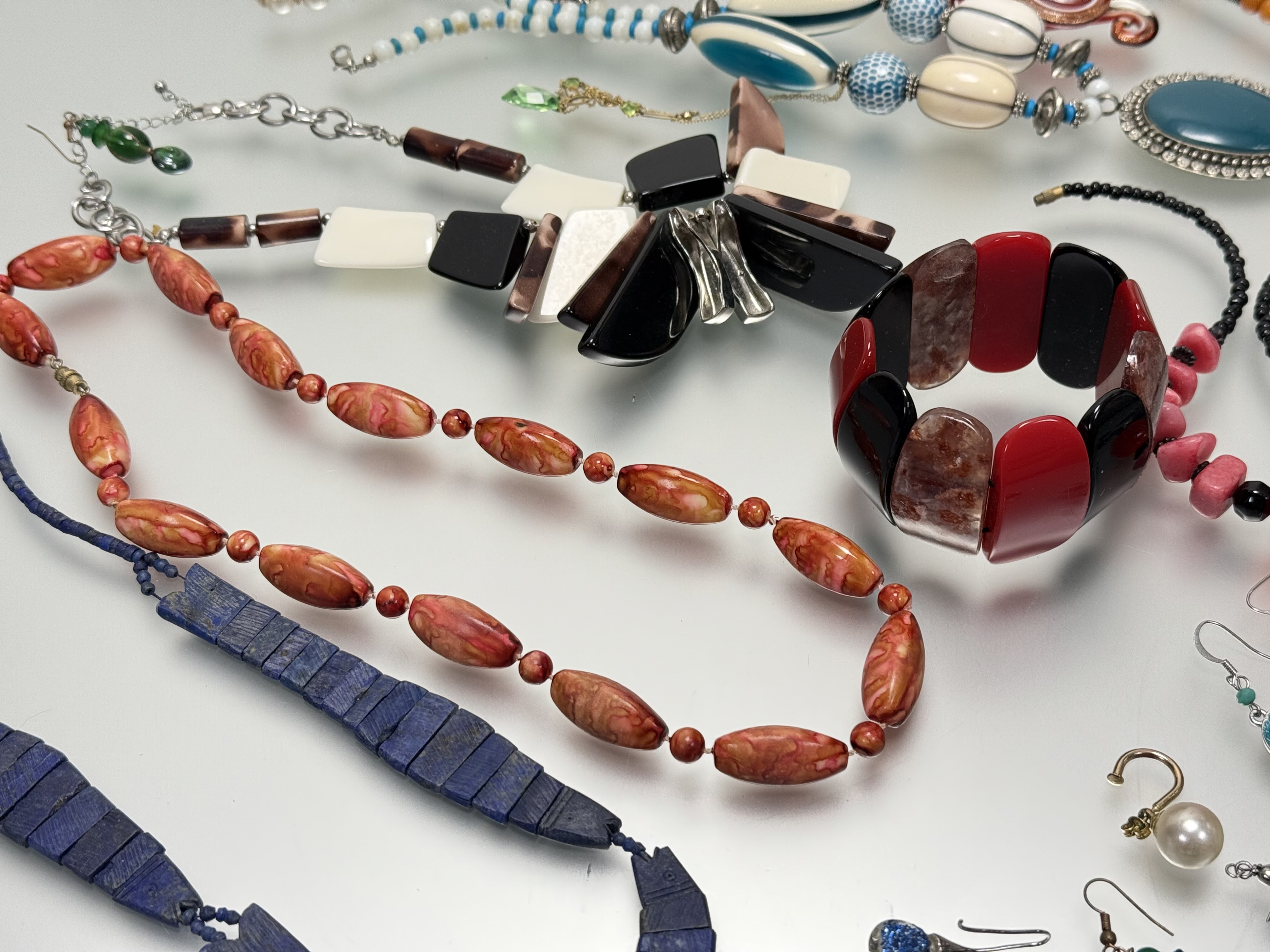 A collection of fashion costume jewellery to include bead necklaces, paste pearls, ceramic panel - Image 2 of 4