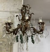 A modern French-style chandelier, eight arms with patinated finish and cut glass droplets, faux