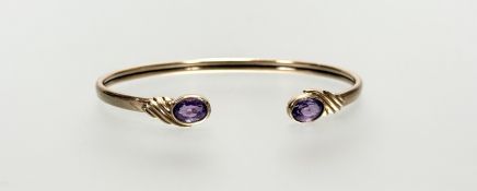A 9ct gold expanding bangle set oval facet cut amethyst to each terminal approximately 0.75ct: d.