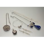 A collection of silver and white metal jewellery to include a silver still bangle with free-