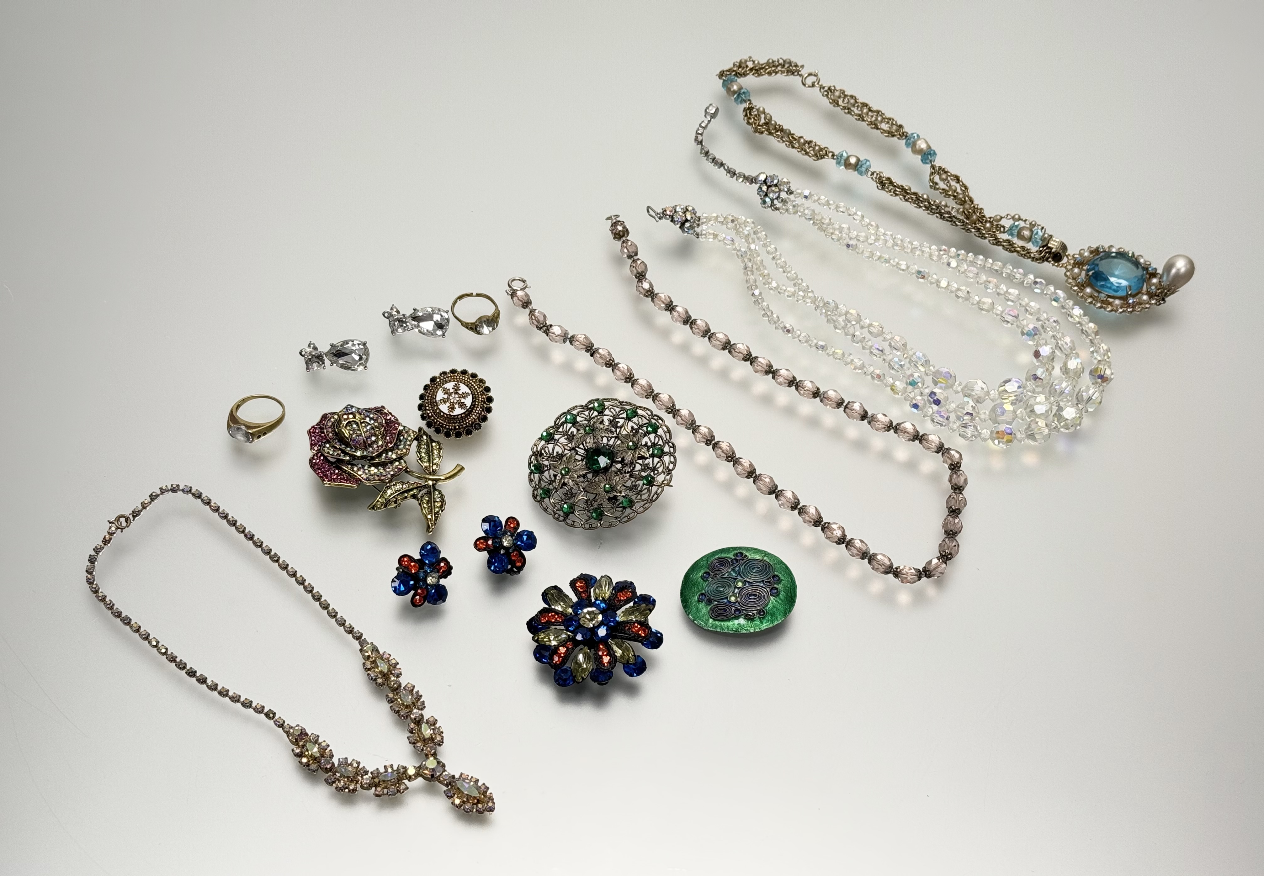 An Austrian iredescent three stand graduated faceted crystal bead necklace: l. x 20cm together