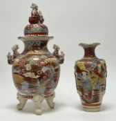 An early 20thc Japanese Satsuma tripod jar with cover, painted with figures in a landscape with twin