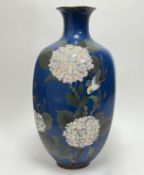 A large Japanese Meiji period baluster form cloisonne vase with faceted sides, decorated with