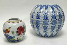 A 20thc Chinese Famille Rose porcelain ginger jar, decorated with a bird amongst foliage in