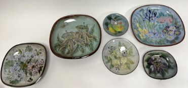 A collection of six Chelsea Pottery footed dishes of varying sizes, each with polychrome