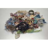 A very large collection of costume jewellery to include, bead necklaces, a white metal cuff-style