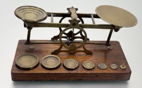 A Victorian S.Mordan & Co London brass postal scales on wooden base with complete set of brass