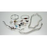 A collection of silver jewellery to include a pear-shaped moonstone bar and chain link bracelet