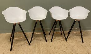 A set of four modern breakfast bar stools, with white bucket seats raised on turned wood supports