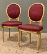 A pair of Louis XV-style side chairs, patinated wood and gilt frames with watered silk upholstery (
