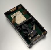 A 20thc black enamelled brass sextant in a fitted wooden case with a Henry Hughes & Sons Ltd