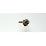 A 14ct gold green tourmaline dress ring, the square-cut stone in a collet setting within a band of