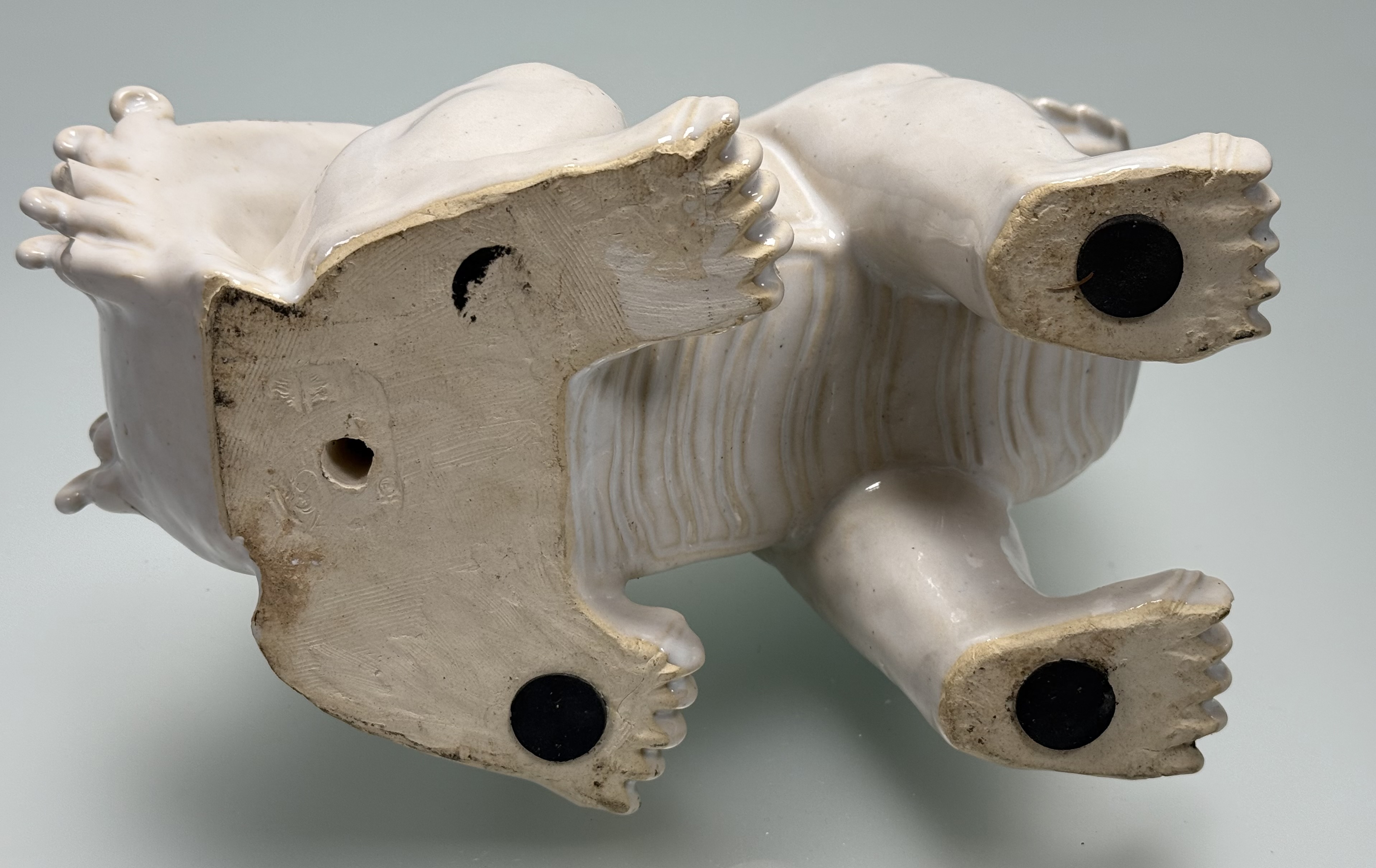 A Chinese white-glazed pottery model of a lion dog, probably 20th century. Height 26cm. - Image 5 of 5
