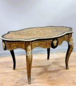 A 19thc. French boullework table, with elaborate scrolling top of cartouche form, shaped apron,