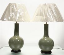 A pair of large Chinese celadon-glazed porcelain vasiform table lamps, 20th century, each of flask