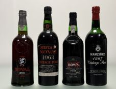 A group of four bottles of port: Martinez 1967 (fill level at shoulder); Quinta Do Noval 1963; Noval
