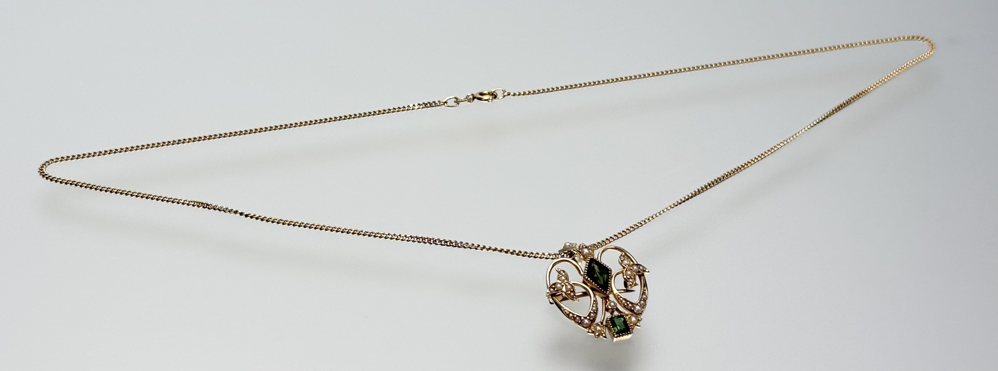 An Edwardian 15ct gold, green tourmaline and seed pearl pendant with brooch fitting, of open - Image 2 of 2