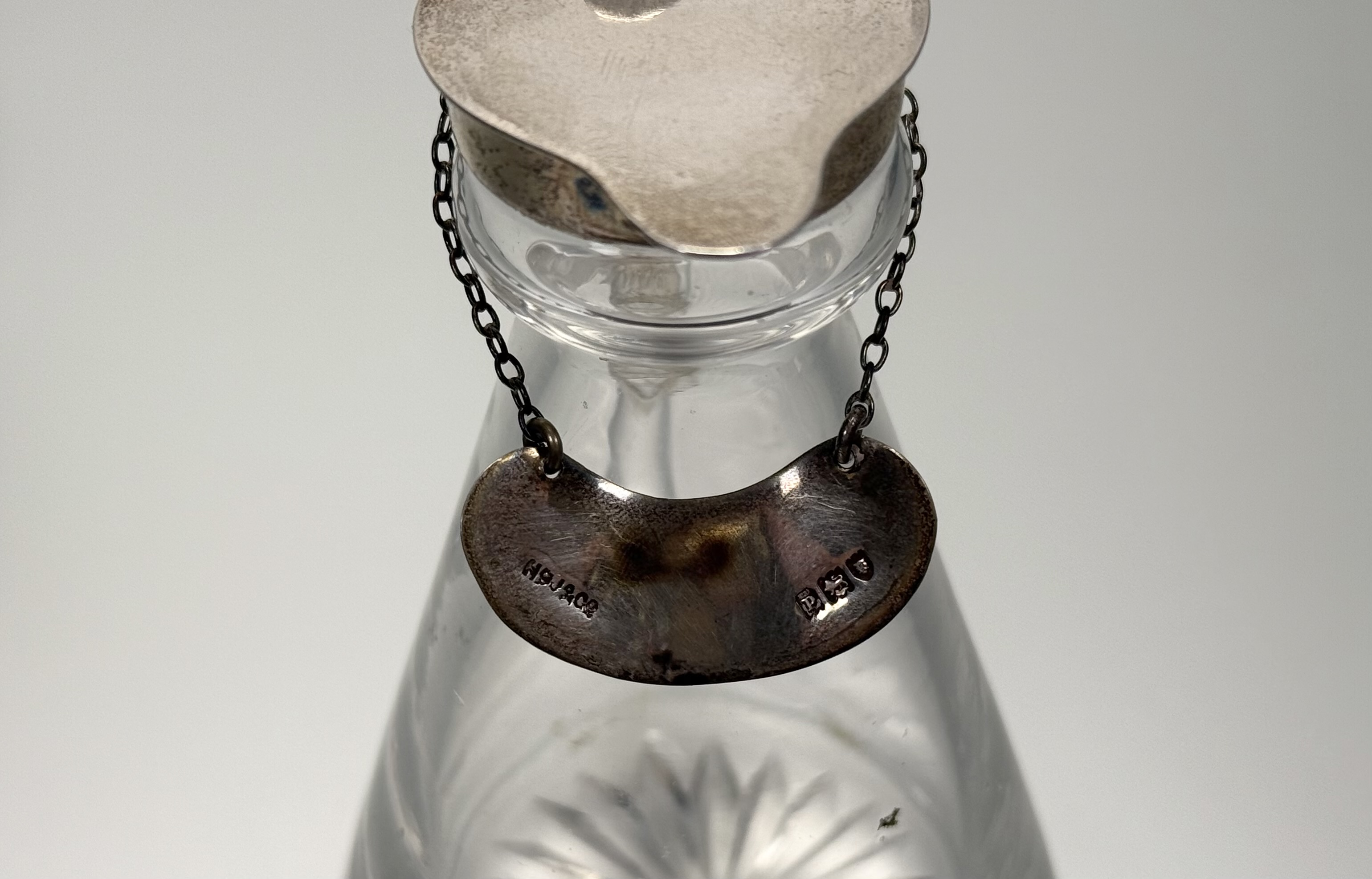 An assembled set of four silver-mounted cut-glass toddy jugs, two Hukin & Heath, Birmingham 1931, - Image 3 of 5
