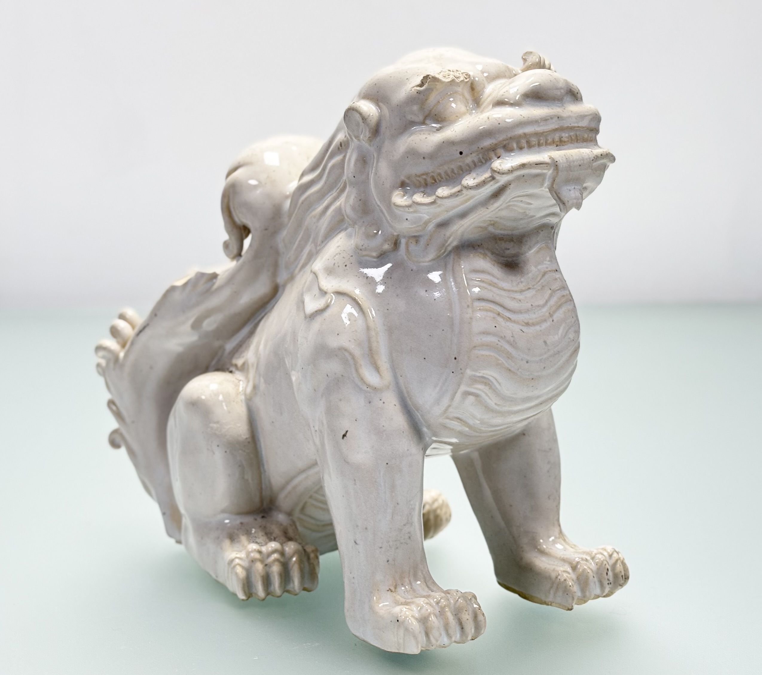 A Chinese white-glazed pottery model of a lion dog, probably 20th century. Height 26cm. - Image 2 of 5