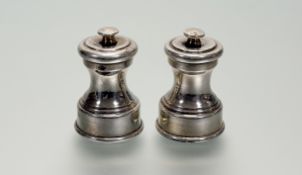 A pair of Edwardian silver pepperettes, Birmingham 1908 (maker's mark indistinct), of baluster form.