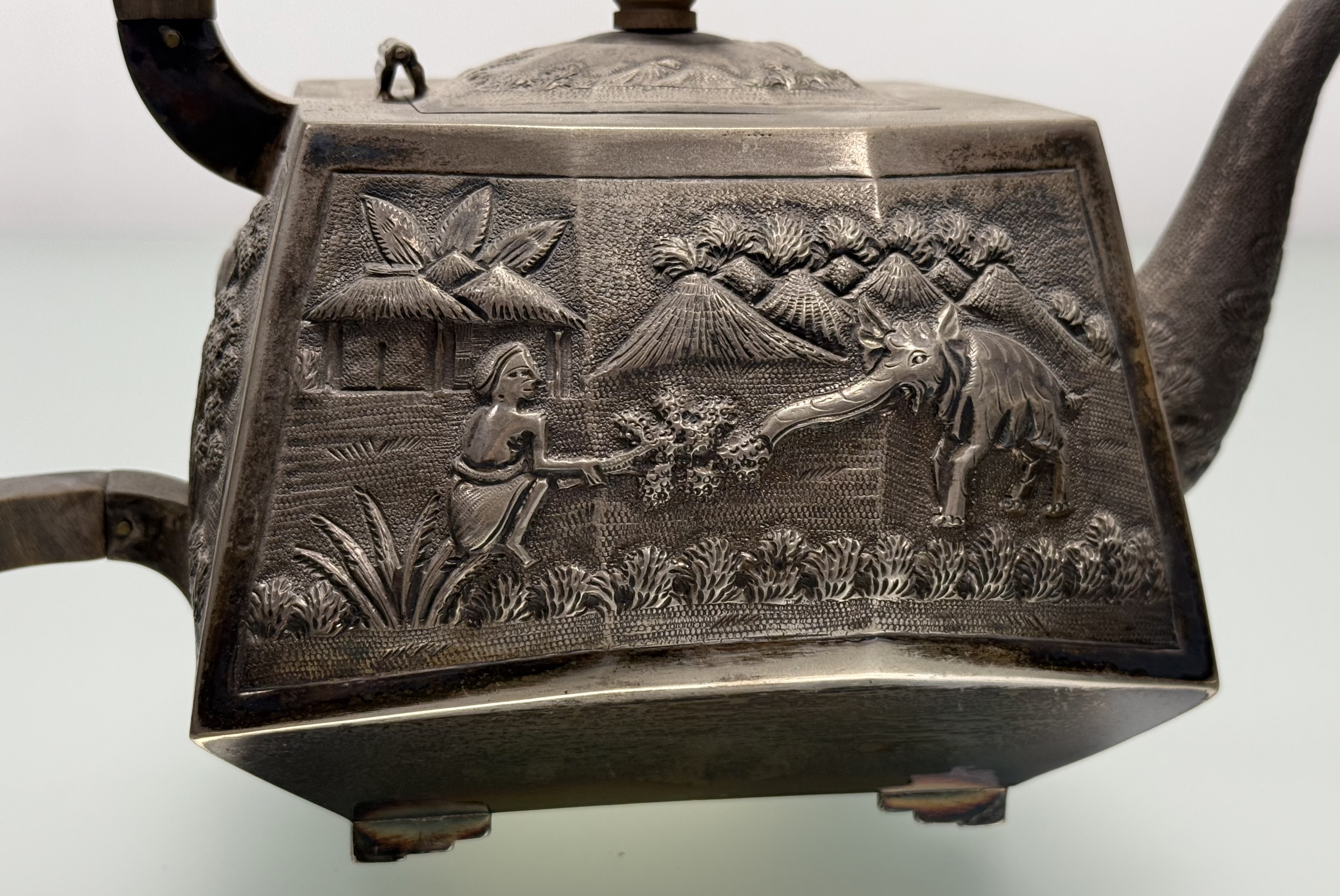 A sterling silver three piece tea service, probably Indian, c. 1900, each piece repousse with - Image 3 of 7